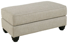 Blending comfort and style, this ottoman cradles your tired feet at the end of a long day. The distinctive look of heavily textured fabric in a light, neutral hue is enhanced by lighter flax peeking through. Whether paired with another piece or used on it