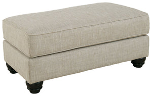 Blending comfort and style, this ottoman cradles your tired feet at the end of a long day. The distinctive look of heavily textured fabric in a light, neutral hue is enhanced by lighter flax peeking through. Whether paired with another piece or used on it