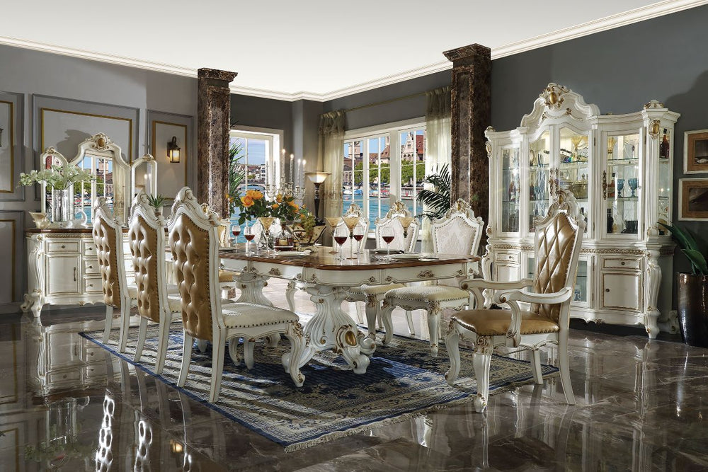 Inspire your home and create an upscale atmosphere with the Picardy dining room collection. This dining table adds classic style to any sitting area featuring a traditional handcrafted design. The dual pedestal table features ornate feet, an intricately c