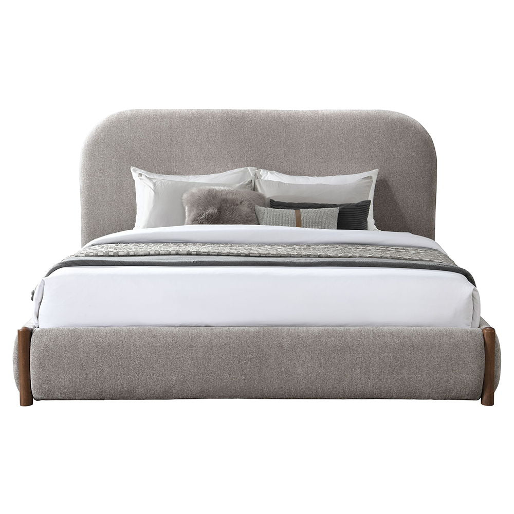The Orane collection bed wrapped in luxurious gray fabric, combines style and functionality with a low profile footboard and convenient storage. Its full upholstered design offers a sleek, modern look, while the storage footboard provides practicality wit