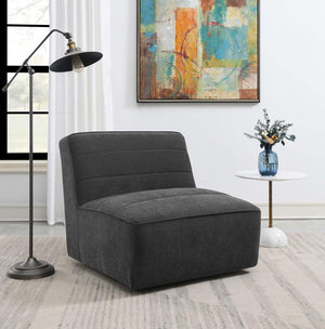  this playful accent chair offers a boxy style and a flush base that sinks into a space effortlessly. Wrappe