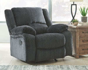  this rocker recliner lets you kick back in reliable style. The thick