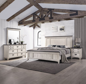This exquisite bedroom collection epitomizes timeless elegance, with its classic silhouettes and refined antique finish. The bed, distinguished by its beautifully paneled headboard, anchors the space with its traditional charm. An integrated footboard ben