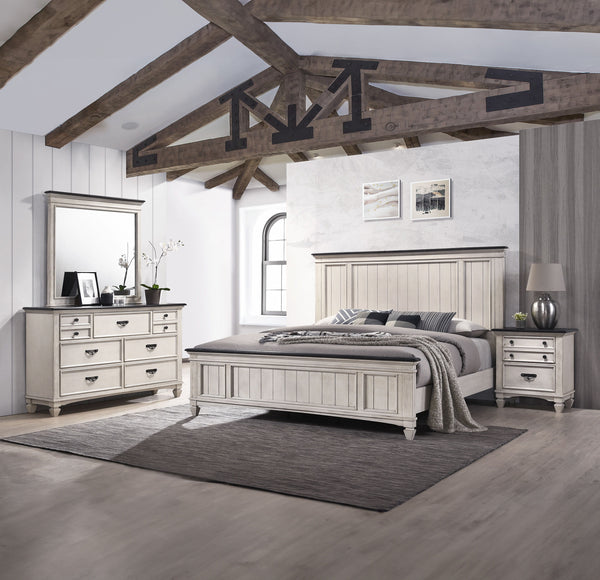 This exquisite bedroom collection epitomizes timeless elegance, with its classic silhouettes and refined antique finish. The bed, distinguished by its beautifully paneled headboard, anchors the space with its traditional charm. An integrated footboard ben