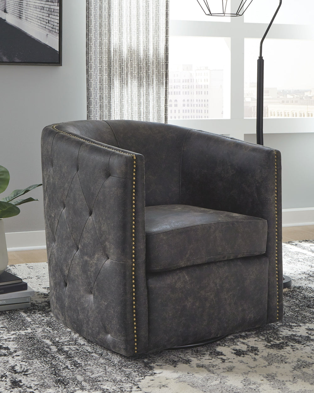 Classic style gets an urban upgrade in this cool accent chair. The barrel back and tufted sides evoke swanky private clubs while the distressed black faux leather keeps it current.<br><br><b>Additional Dimensions</b><br><ul><li>Arm height: 27.38-"</li><li