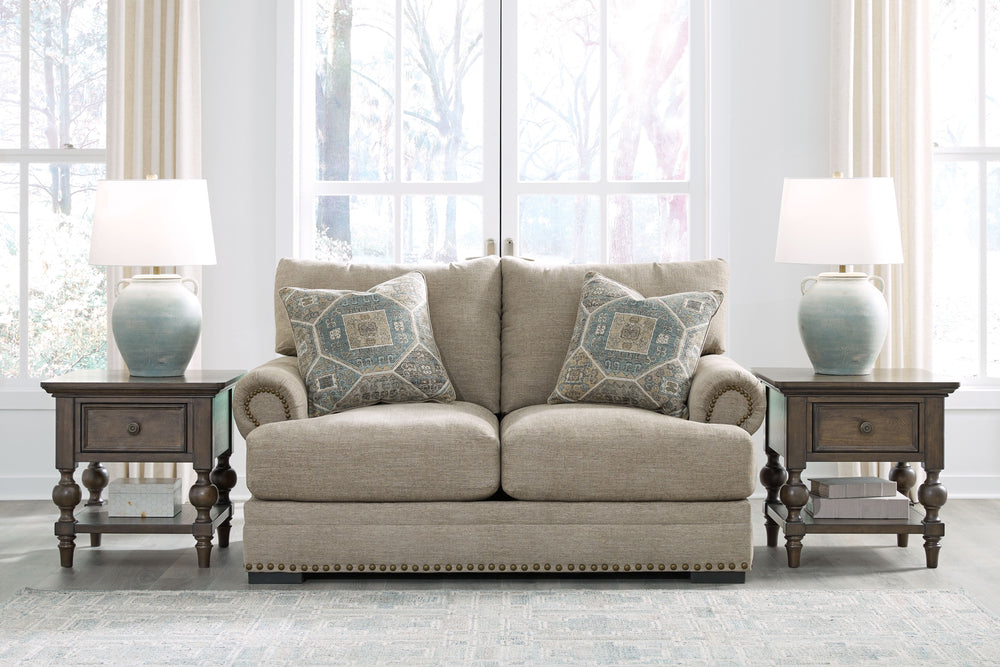 Looking to enhance your home-'s visual appeal? This loveseat offers sophisticated design, comfort and elegance with tonal colors, roll arms and nailhead accents. Enjoy optimal coziness as you nestle into luxurious soft upholstery and feather-blend cushion
