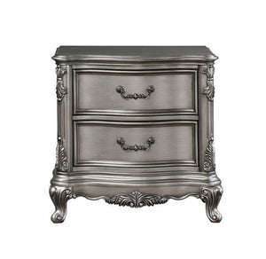  featuring intricate carvings that embody the period. The wingback headboard is a classic design is accented with crystal-l