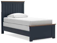 Add homespun charm to your restful retreat. A modern take on a timeless silhouette, this twin panel bed pairs a dark slate blue finish with light brown accents. The slatted headboard in a classic Shaker style brings an air of beautiful simplicity to the b