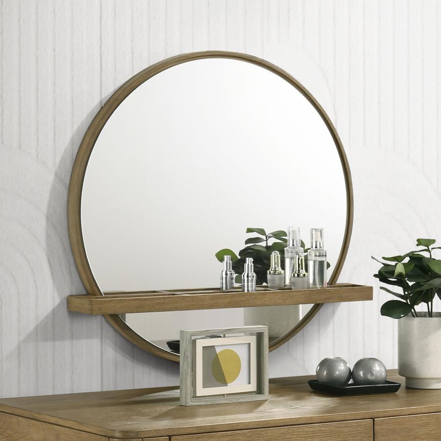 Add a chic vanity mirror over a vanity desk or your dresser to create the ideal place to get ready for the day. The mirror features a round profile with a wooden frame and straight, horizontal shelf. Its sand finish is perfect to complement the wood grain