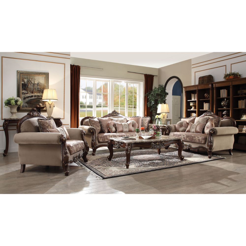 Welcome the essence of lavish living into your home with the Mehadi sofa. Shapely front posts with detailed carving, follow the elegant curve of the rolled arms that make a transition to the wood trimmed arched padded backrest which is silhouetted by a ca