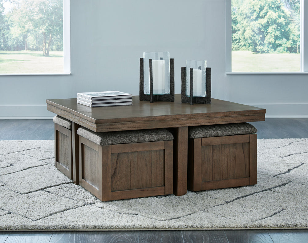 Elevate your entertainment experience with this coffee table with stools. A functional companion for your seating area, itâ€™s defined by a richly versatile finish. Instantly upgrade game days and movie nightsâ€”the four stools wheel out easily with caste