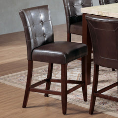 This transitional dining chairs collection will transform to your kitchen, dining or living room with a charming and elegant style. Fully upholstered in PU, crafted with selected quality materials, features button tufted backrest and walnut tapered legs.<