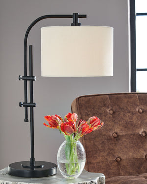  and is adjustable to provide targeted illumination. Topped off with a crisp white drum shade