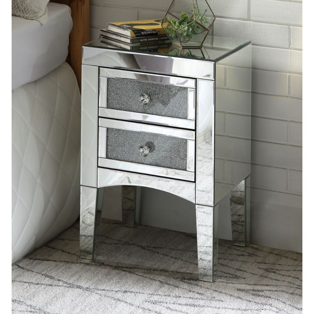 Assembled, Rectangular Night Table Storage: 2 Drw Features: Mirrored Finish, Front Drawer w/w/Faux Crystals & Clear Glass, Mirrored Tapered Leg (Open Base) CONSTRUCTION Mirrored Case Frame: 4mm Beveled Mirror, MDF