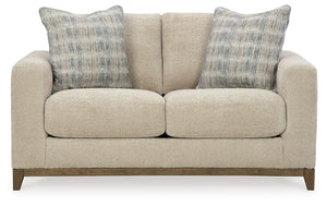  showcasing soft upholstery accented with a transitional wood trim. As refined as it 
