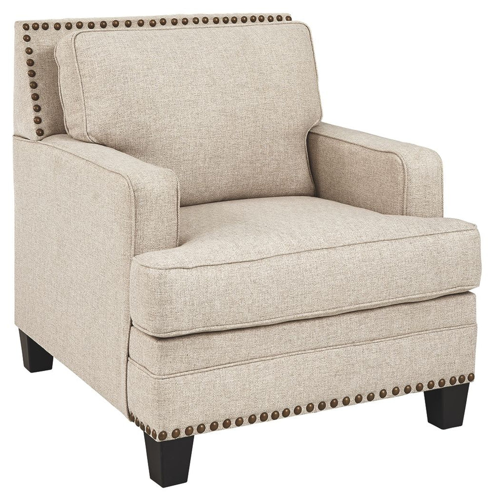 A case of contemporary and classic style influences coming together in a beautiful way, this chair in beige brings a fresh perspective to modern farmhouse living. Distinctive elements include t-cushioning that wraps around setback track arms, nailhead tri