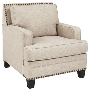 A case of contemporary and classic style influences coming together in a beautiful way, this chair in beige brings a fresh perspective to modern farmhouse living. Distinctive elements include t-cushioning that wraps around setback track arms, nailhead tri