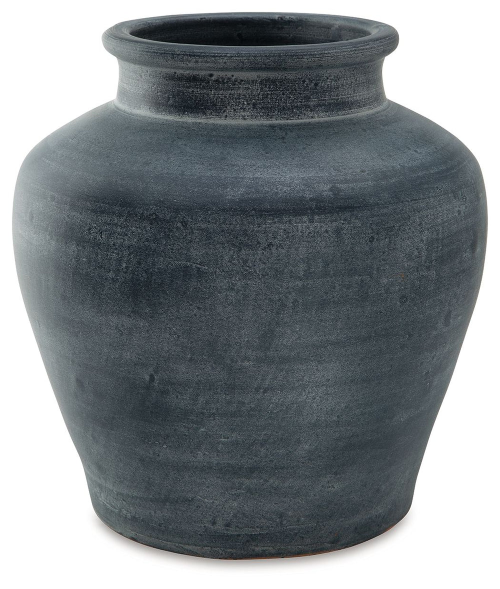 Understated in its beauty, this vase offers a traditional feel courtesy of its terra cotta construction. The antiqued look is brought into the present with a distressed blue hue. It-'s an effortless way to elevate a centerpiece, bookshelf or mantle. Add f