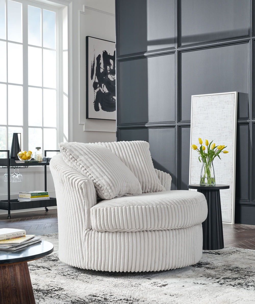 This swivel chair takes style and comfort full circle. Its plush, neutral corduroy upholstery is casually cool and beautifully on trend, while throw pillows elevate the cozy factor. A smooth-gliding 360-degree swivel lets you go with the flow. Come on, yo