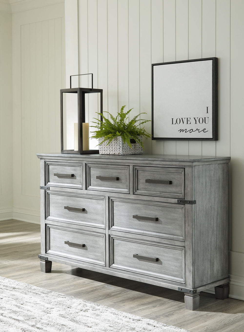 What-'s old is what-'s new with this dresser. Serving up a fresh look in urban farmhouse style, this eclectic piece features a light weathered gray finish with dark aged bronze-tone accents and metal straps for a casually cool sensibility. Profiled drawer