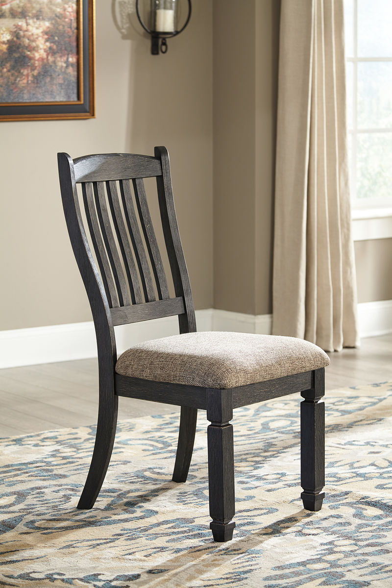 Unique two-tone finish with a combination of Oak and Acacia substrates combining a trendy textured antique black color with table and server tops finished in a textural weathered oak finish. Rectangular dining table features six convenient drawers for sto