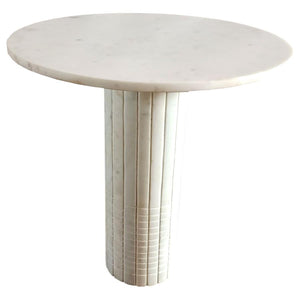 Nestled in a quiet corner, this end table embodies timeless elegance with its genuine white marble top and cylindrical pedestal base. The fluted design features subtle grid textures, reminiscent of neoclassical architectural details. This accent side tabl
