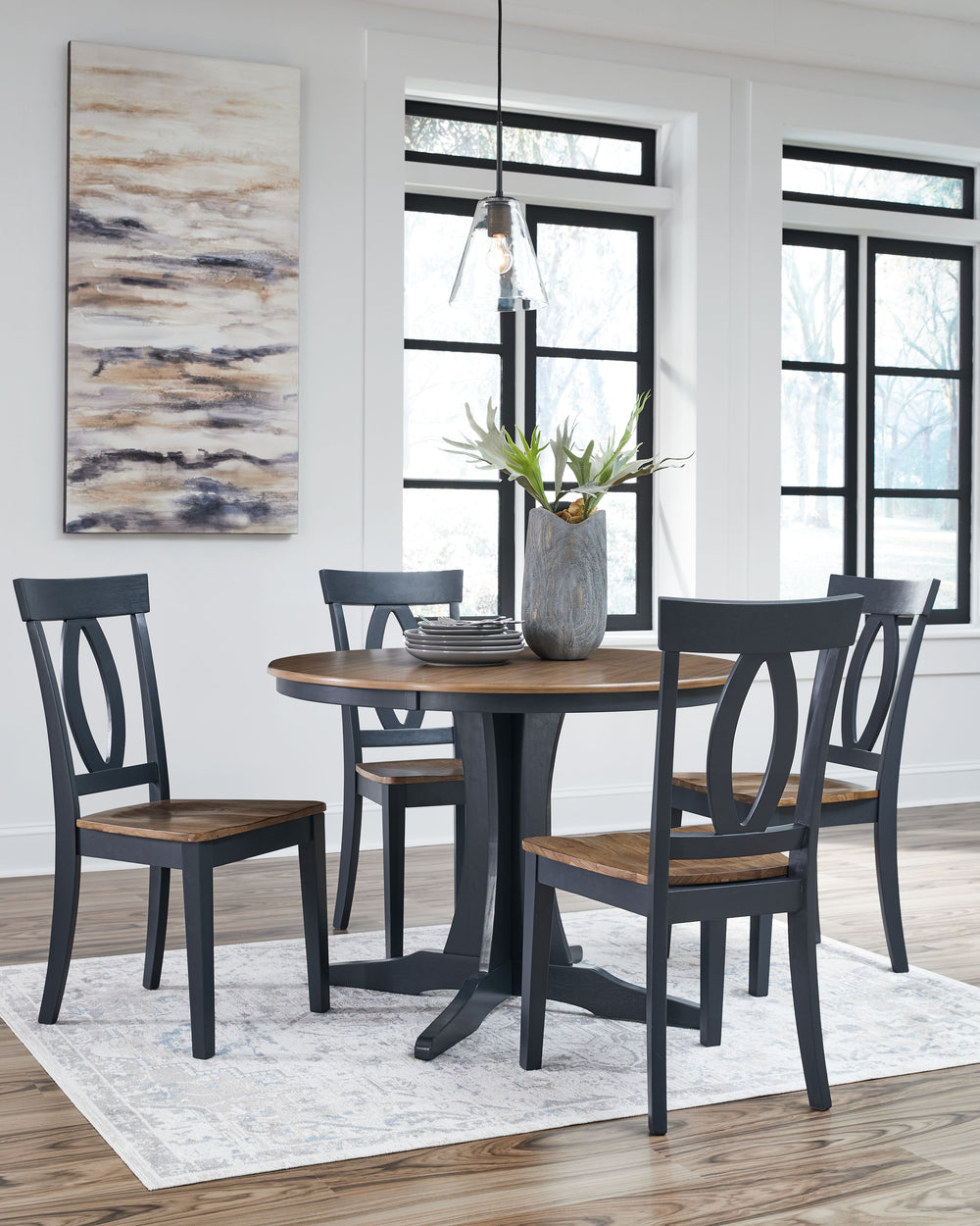 Casual lifestyle design. Made with hardwood solids, Mindi wood veneer and MDF substrates. Outstanding 2-tone finish features a light brown wood tone top with dark slate blue table base and chair frame. Designed for smaller space dining solutions the 42-" 
