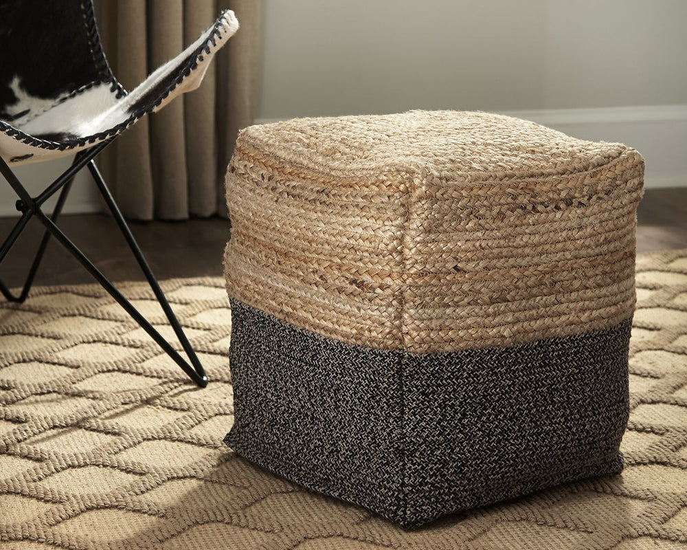 Natural beauty is always in vogue, and this pouf proves it. Braided design in natural jute and gray is simple yet fresh. Stylish stitching and dense filling hold the look together.<br/><br/><b>Product Features</b><ul><li>Jute/cotton blend cover</li><li>De