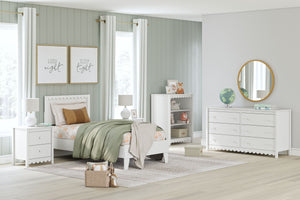Thanks to its playful scallop design, this bedroom package is the perfect fit for cottage or coastal farmhouse interiors. Its matte white finish serves as the perfect backdrop to showcase your personal taste and creativity. Plus the low-profile bed frame 
