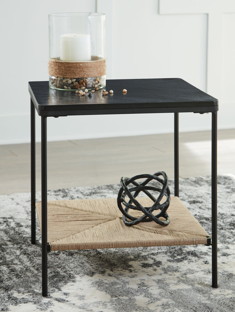 Seeking something outside the ordinary? Look no further than this casual mixed-media accent table. Its impressive black marble top and natural jute bottom shelf give the eclectic design that much more interest. Exuding a sense of ease that-'s sure to plea