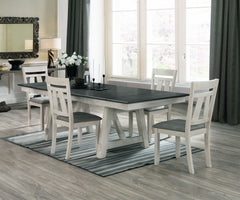 Create a warm and inviting dining space with this beautifully designed set that perfectly blends rustic charm with modern elegance. The two-tone finish features a striking dark tabletop with dual draw leaves contrasted with a soft, distressed base, adding