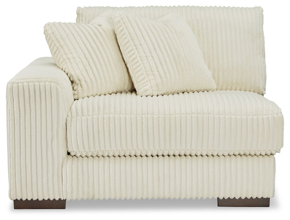 Plush and posh. Showcase your eye for on-trend texture with the statement-making cord upholstery of this sectional with chaise. Its stunningly soft fabric entices in an ivory hue, complementing contemporary color palettes. Sink into the cushions and plan 