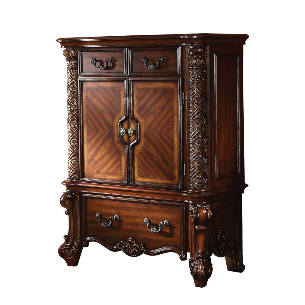 Create an elegant, traditional design in your bedroom with the cherry Vendome chest. This hand-crafted piece inspired from the luxurious designs of the past, this three-drawer, two-door chest features elaborate wood carving details, traditional hardware a