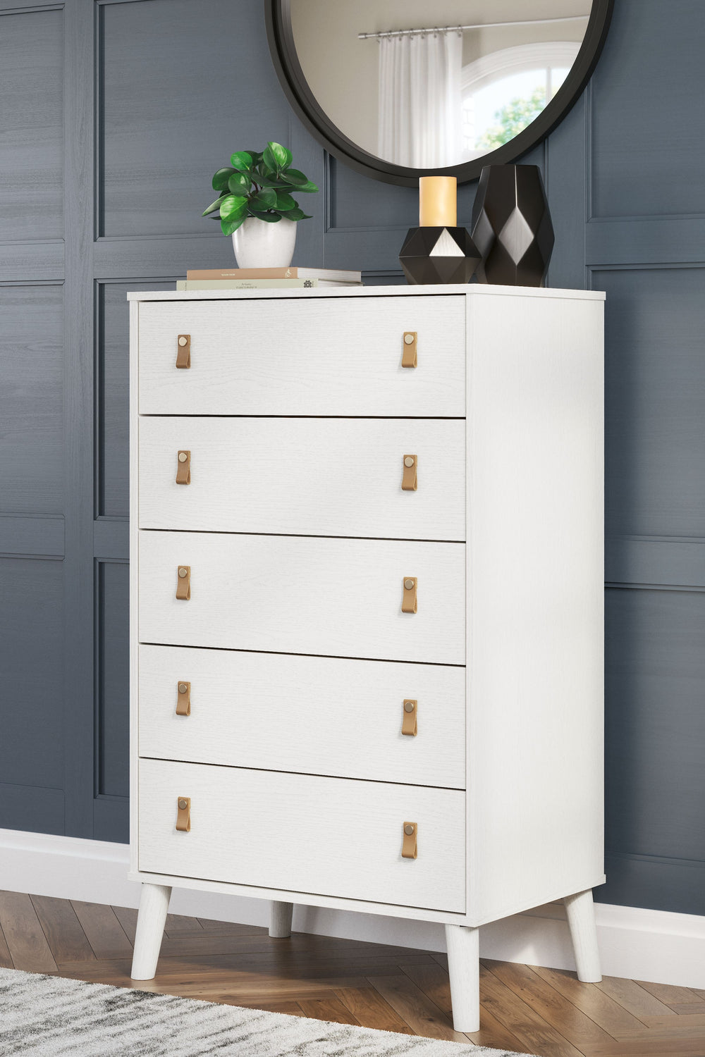 Dare to take minimalism to the max. This chest of drawers has an air of sleek simplicity thanks to its white painted finish with subtle replicated wood grain. Magnificently mod splay legs are a compelling complement to the streamlined design. And with two