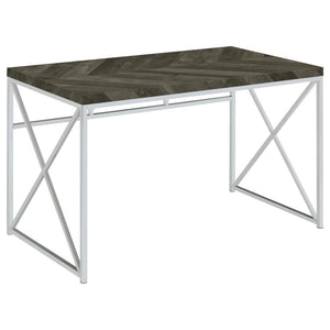 Add modern sophistication to your workspace with this writing desk, featuring a sleek rustic grey herringbone finish that blends contemporary and industrial styles. Its sturdy metal frame, finished in polished chrome, provides a geometric aesthetic with b