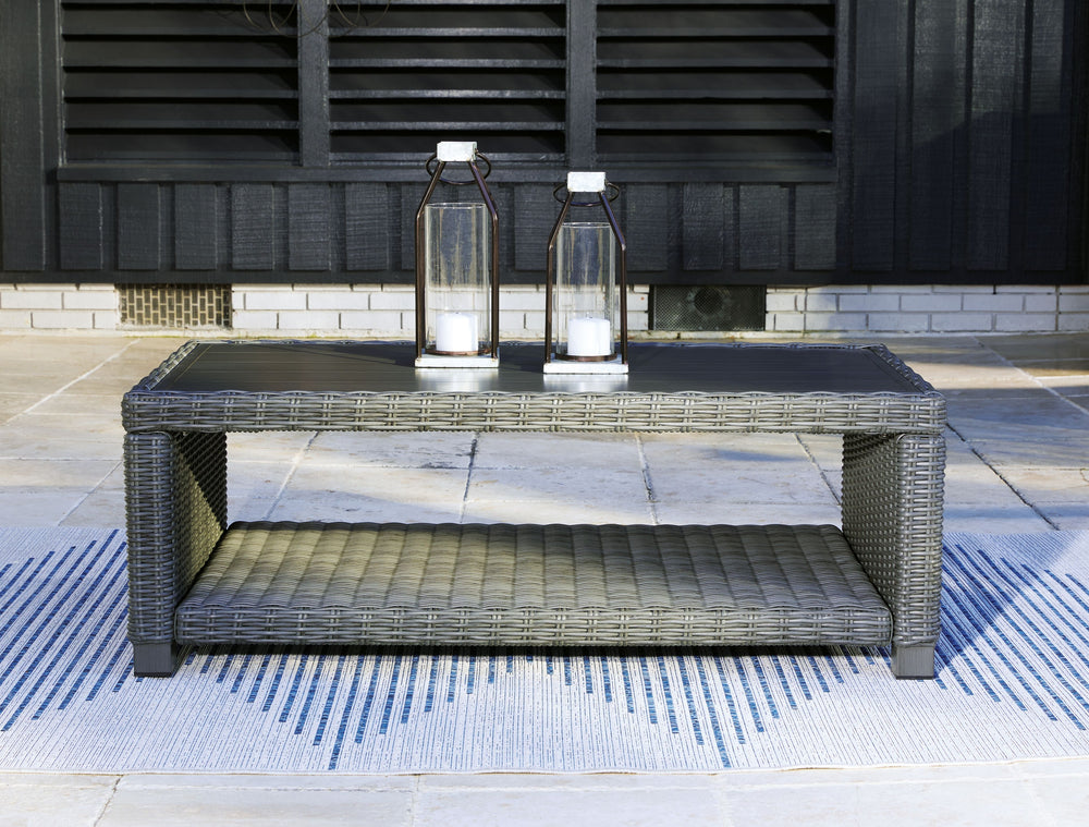 Add a distinguished touch of gray to your outdoor living space with this coffee table. This head-turning table is made with resin wicker over an aluminum frame for a relaxed look that provides seasons of enjoyment. Its aluminum top combines the exceptiona