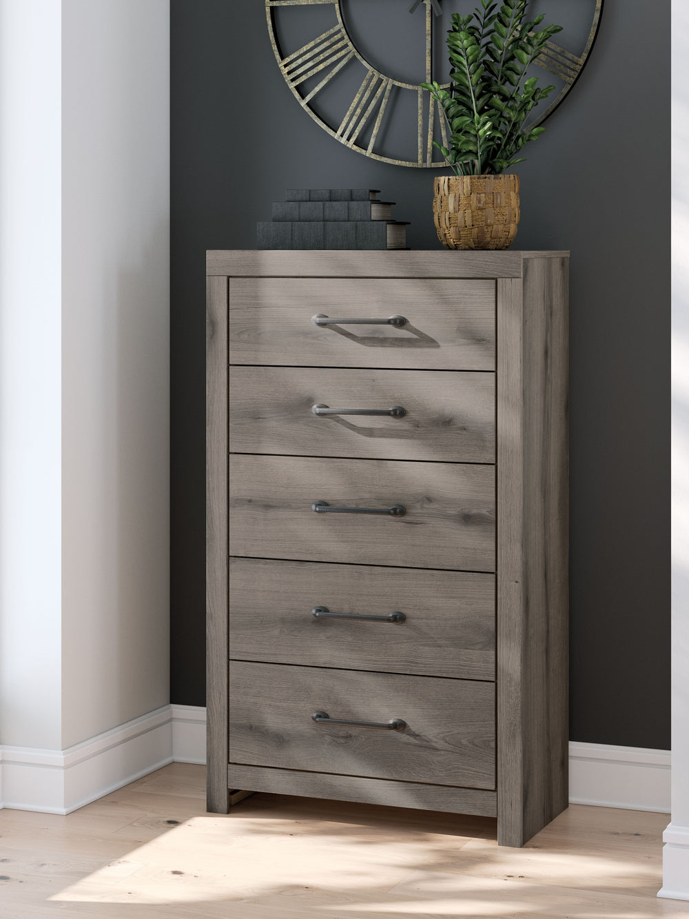 Combining a casual aesthetic with functional flair, this chest of drawers suits styles from rustic to industrial. Its smooth-gliding drawers store everyday essentials with ease, from clothes to bed linens. Elongated drawer pulls in a dark hue polish off t