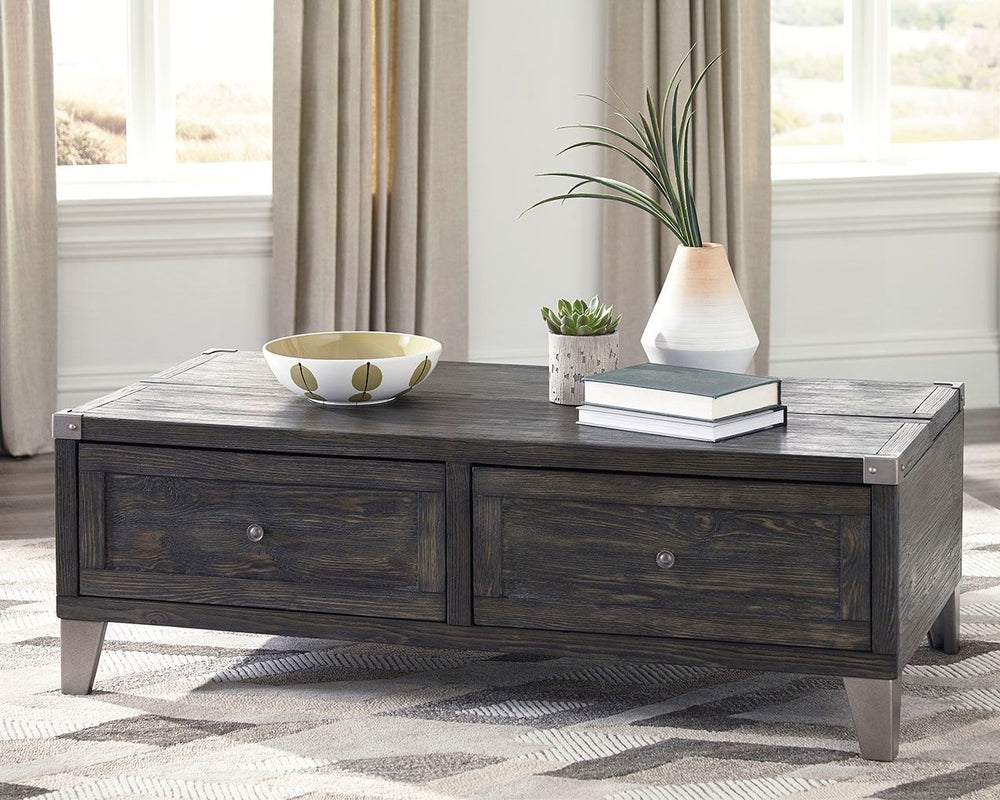 Mixed material lift top table truly elevates rustic-industrial style. Weather-washed pine wood and veneers are contrasted with canted metal legs and corner bracket accents for a uniquely chic merger of earthy beauty and contemporary flair. A handy spring-