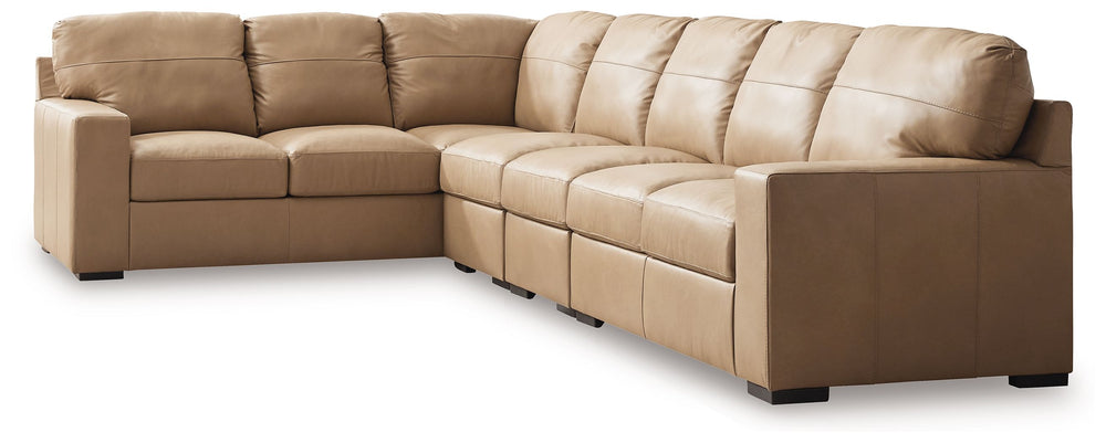 Indulge in attainable, top-of-the-line luxury. With this sectional, you can outfit your home in ultra-sleek style. Genuine leather upholstery on the interior provides the richly refined look and feel you love without breaking the bank. Clean-lined arms po