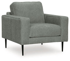 Simple comfort meets modern function in this chair. An apt addition to apartments and other small spaces, the slim-profiled piece welcomes you with its cozy character. A subtle chevron pattern on the cushions refresh the classic neutral hue, elevating the