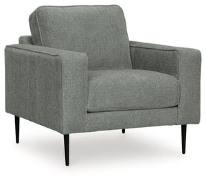 Simple comfort meets modern function in this chair. An apt addition to apartments and other small spaces, the slim-profiled piece welcomes you with its cozy character. A subtle chevron pattern on the cushions refresh the classic neutral hue, elevating the