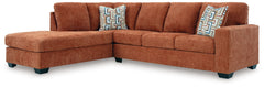 Looking to make a bold statement with color? Liven up your living room with this sectional with chaise. Its trend-right burnt orange upholstery adds a playful pop of color to your decor. Bold and eclectic accent pillows complete the look. Pairing posh sty
