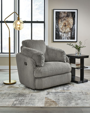  this recliner envelops you in comfort with its barrel shape and soft cord upholstery. It reclines