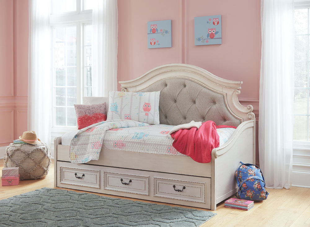 Elevating the art of traditional cottage styling, this darling day bed with storage is your dream bedroom retreat realized. A curvaceous beauty, this brilliant upholstered bed wows with dramatic scalloped details and fanciful trim work. The distressed chi