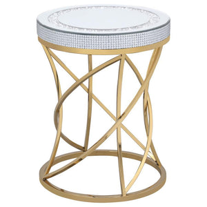Bring glamorous sophistication to your living space with this contemporary round end table. The mirrored tabletop, framed by a jeweled edge and inset with acrylic crystals, adds an alluring touch. The sculpted base, crafted from stainless steel with a gol