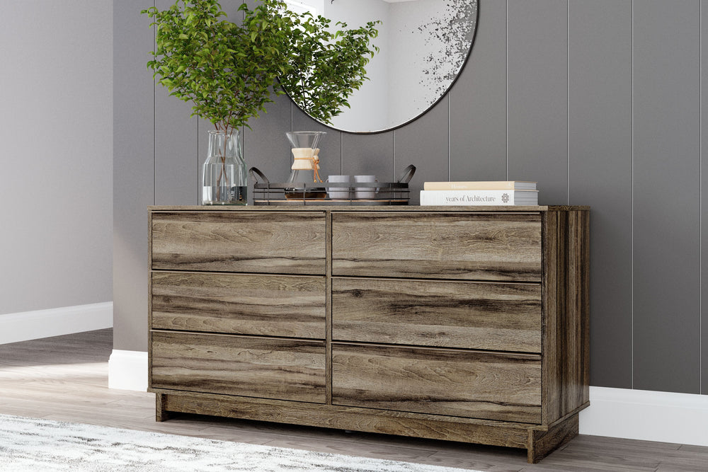 Your modern sanctuary is within reach. The subtle design of this dresser is accented with a low profile base. Its weathered brown finish is complemented with refined champagne-colored handles on the six smooth-gliding drawers.<br><br><b>Additional Dimensi