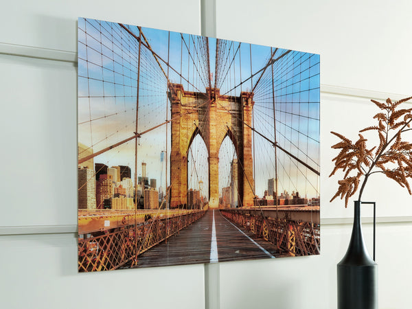  the print on glass showcases the Brooklyn Bridge-'s majestic arches and intricate cables