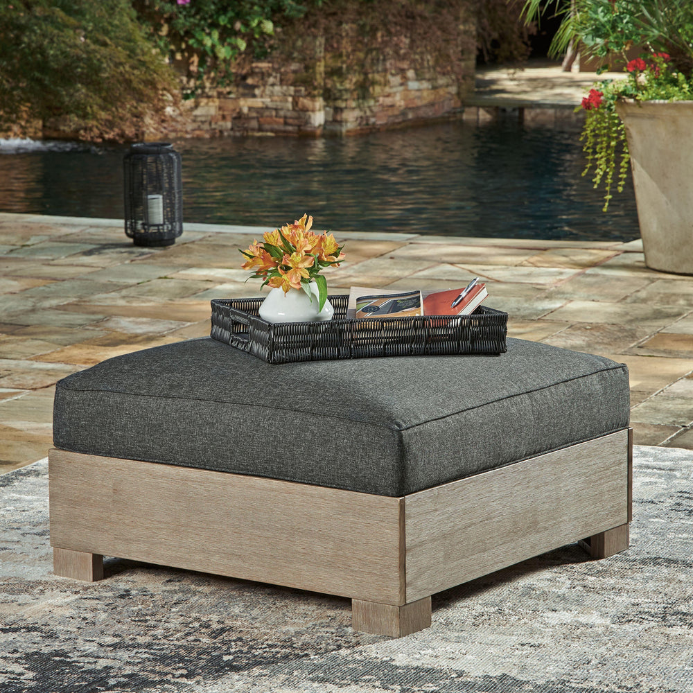 Be the host with the most when you add this simply stunning outdoor ottoman to your patio, porch or poolside. High-performance Nuvella+â„¢ fabric in charcoal harmonizes with the eucalyptus wood frame to craft a richly relaxed sense of style, whether youâ€