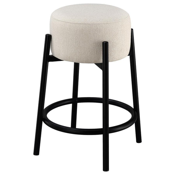  this stool lends an elegant playful charm to any space. The pouf-inspired seat re