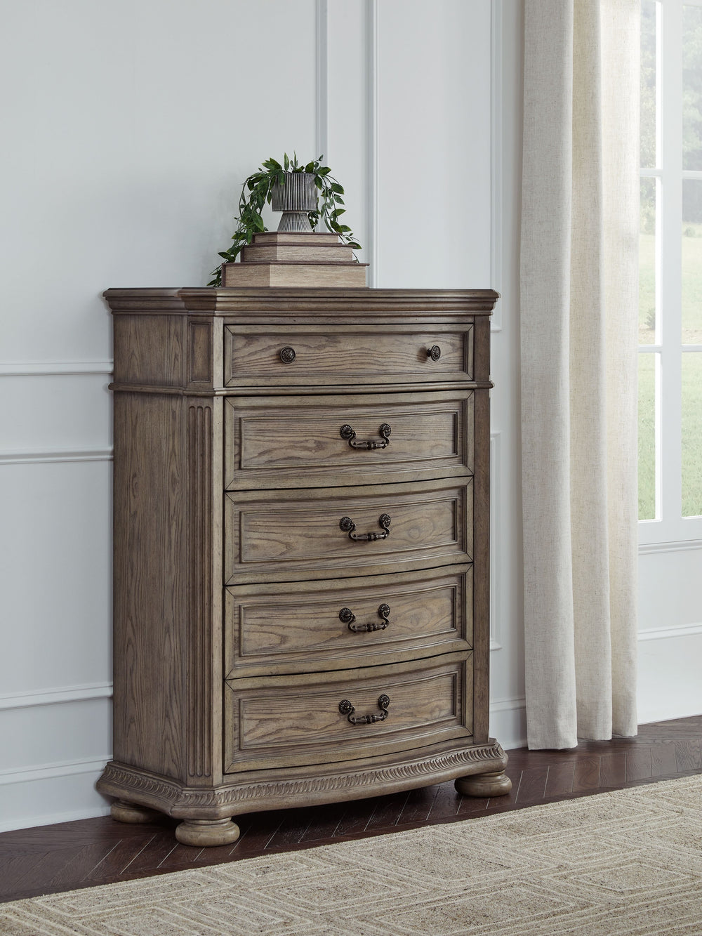 Merging traditional elegance with modern comfort, this chest of drawers takes your bedroom retreat to the next level. Serpentine curves, ash swirl veneer inlays and a glazed antiqued-look finish radiate timeless sophistication. Drawers are packed with amp